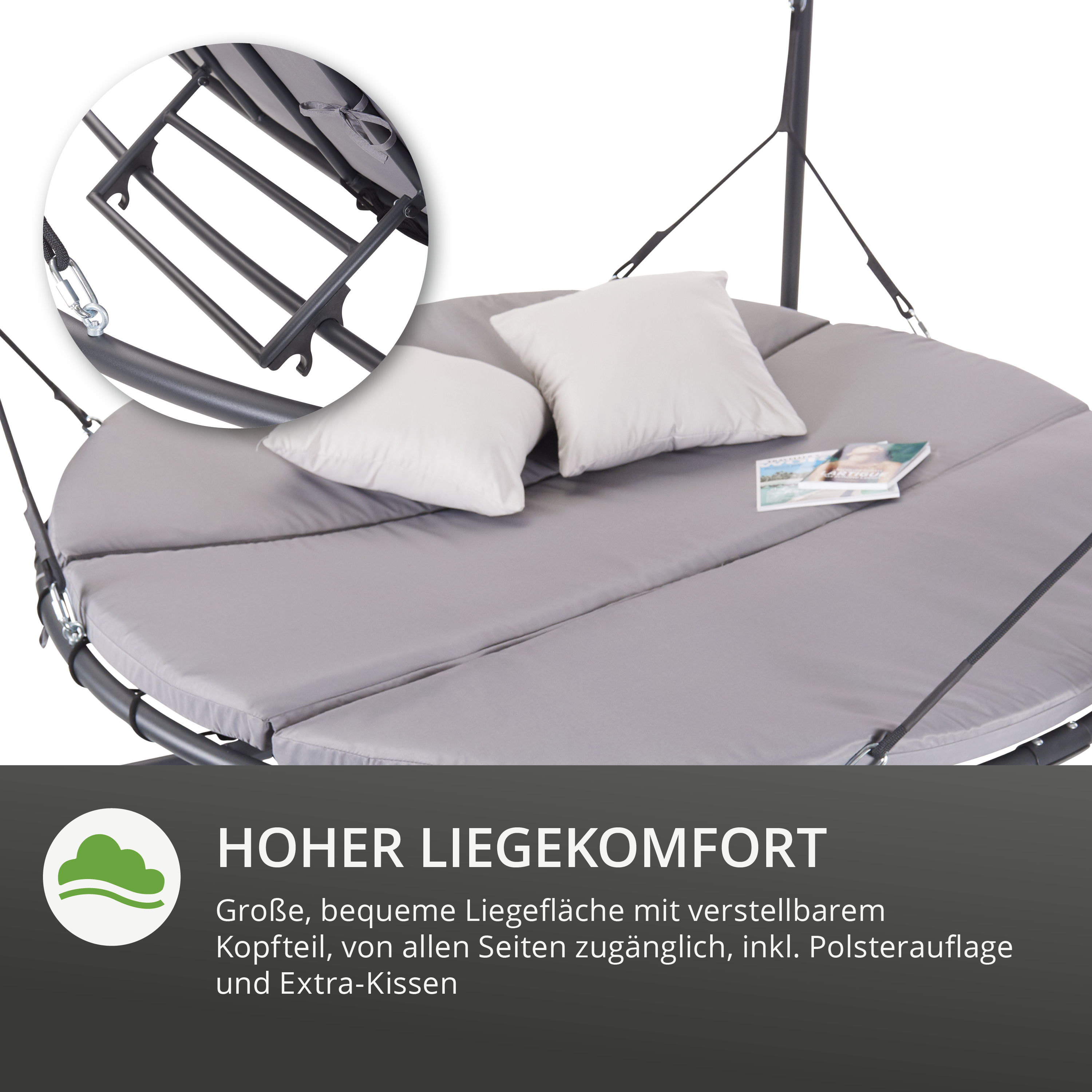 Rundes graues Liegebett mit zwei weißen Kissen und Magazin, verstellbares Kopfteil sichtbar.